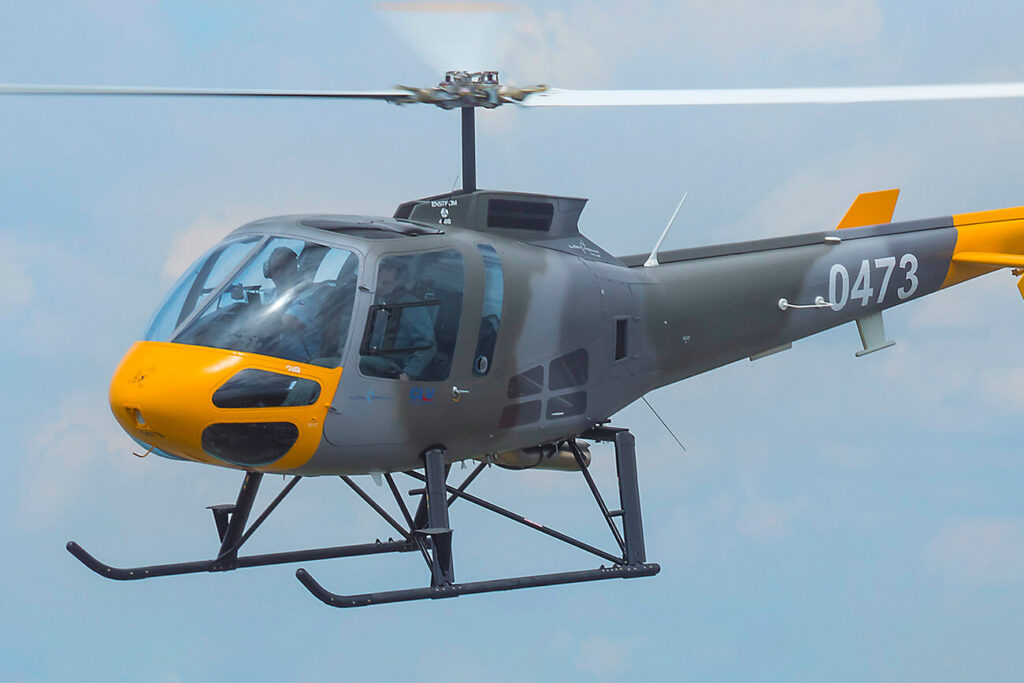 Enstrom military helicopter flying
